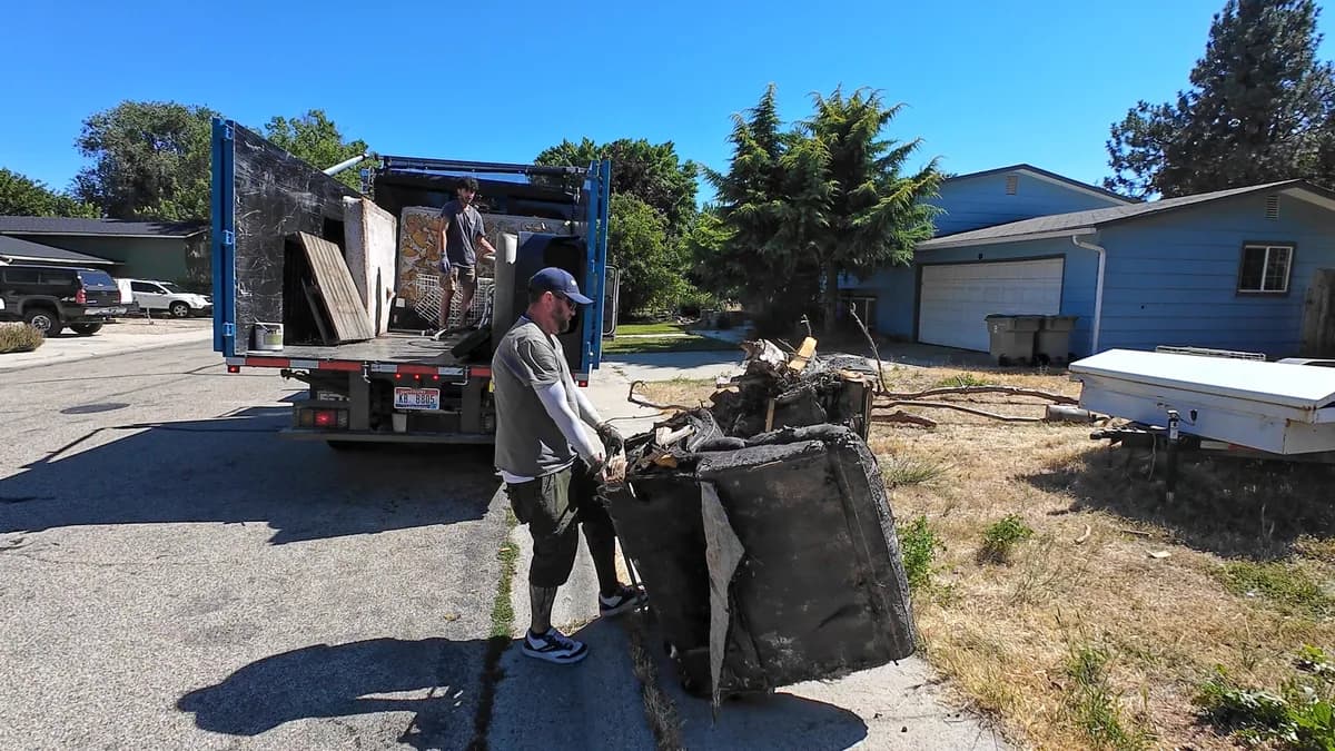Crew loading curbside junk that would otherwise require multiple dump runs in Boise