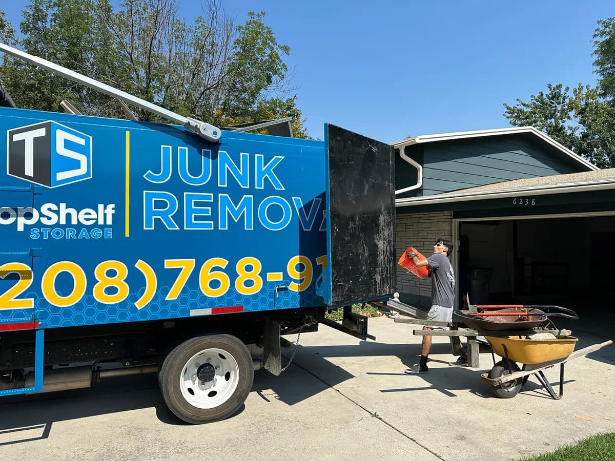 Crew loading household junk for same-day junk removal at a Boise home